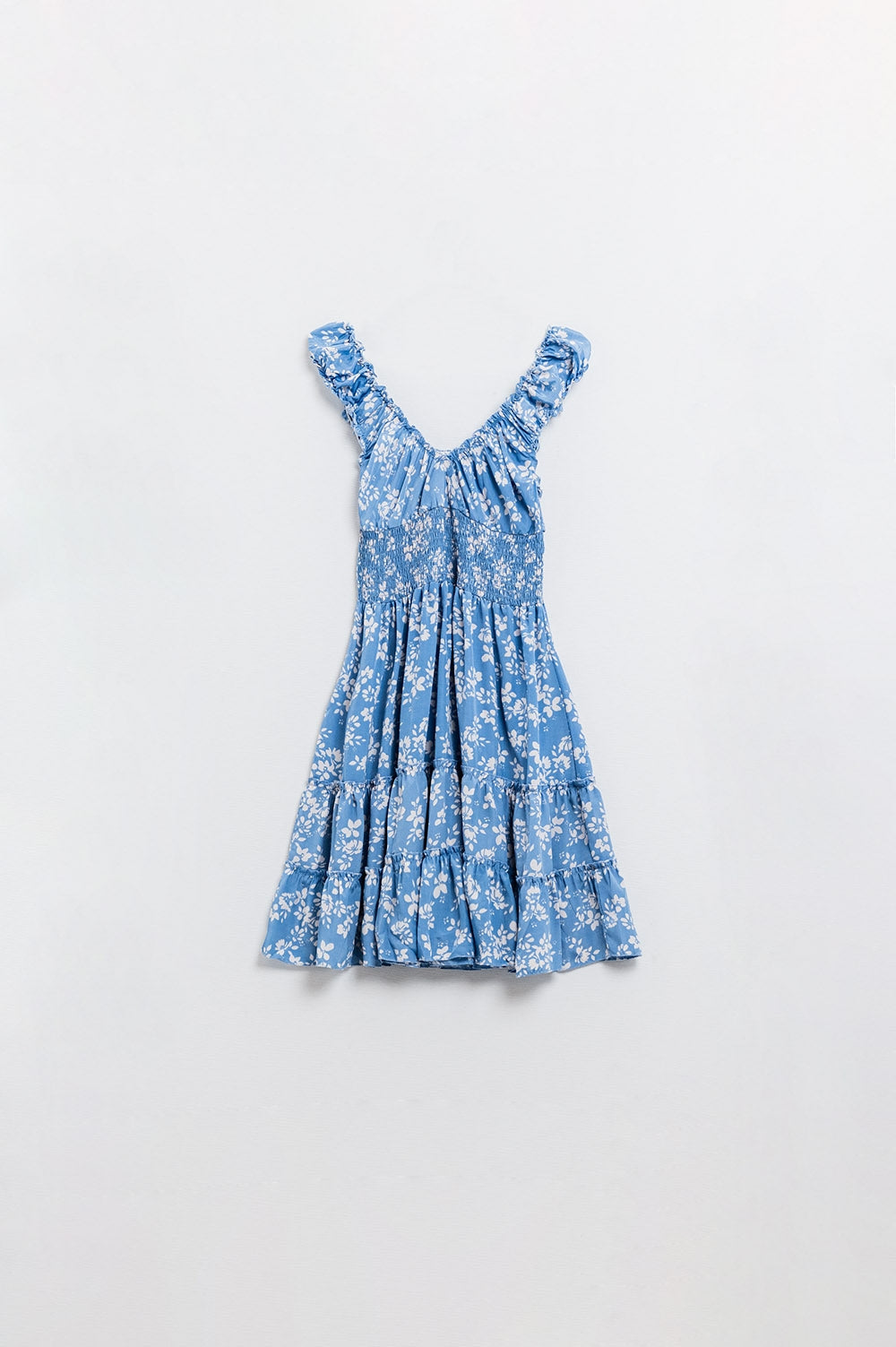 Blauwe korte jurk met witte bloemenprint en elastische taille