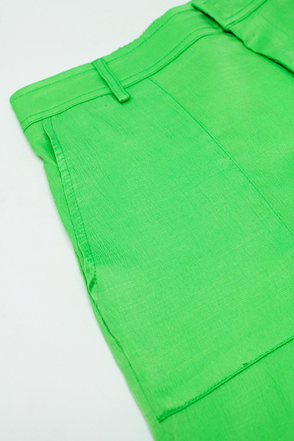 Groene satin broek met zijzakken en riem hoepels