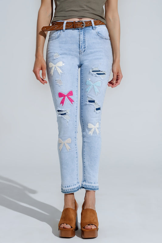 Q2 Lichtblauwe super skinny jeans met strikbandjes en gescheurde gaten