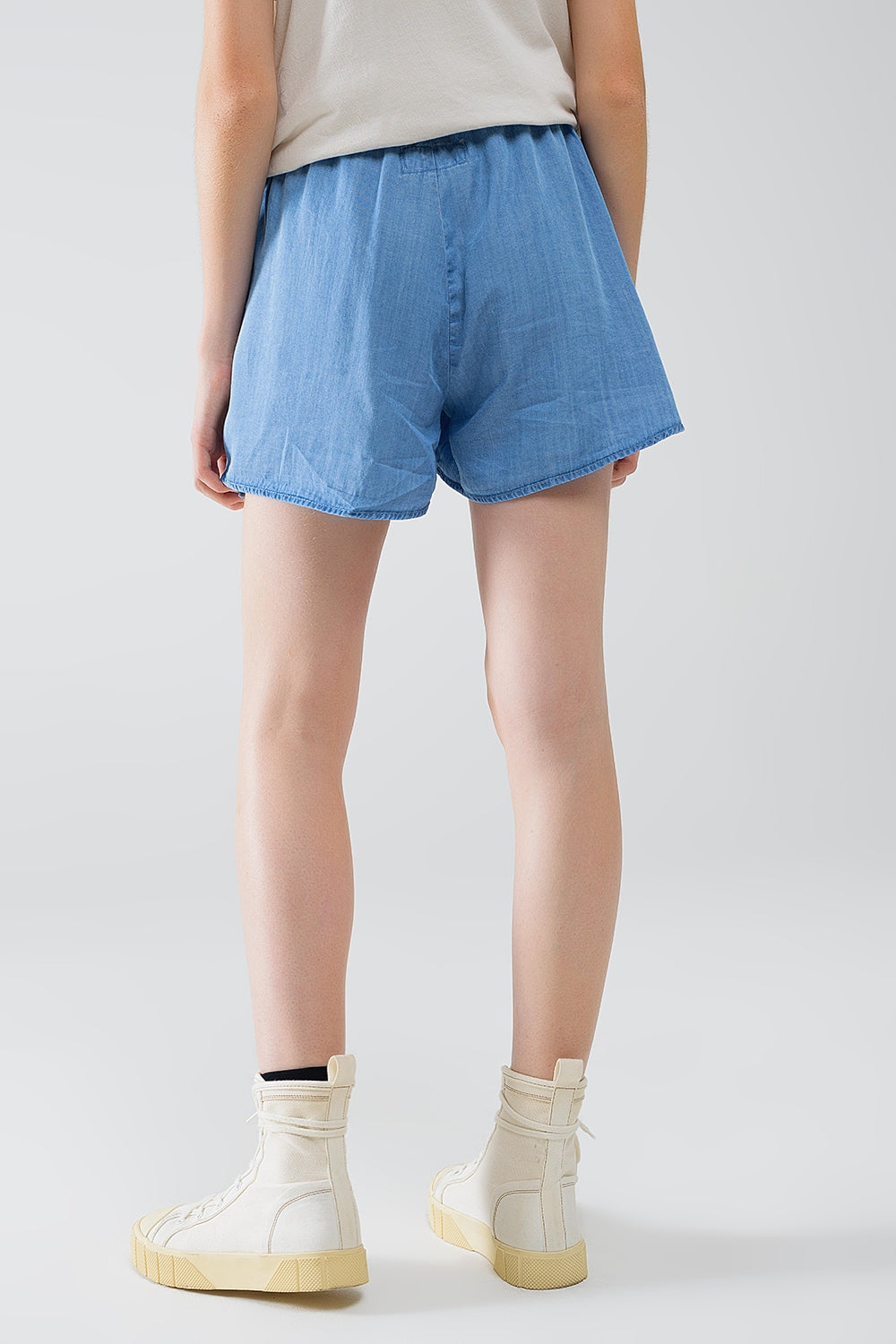 Vloeiende Tencel denim shorts met zijzakken