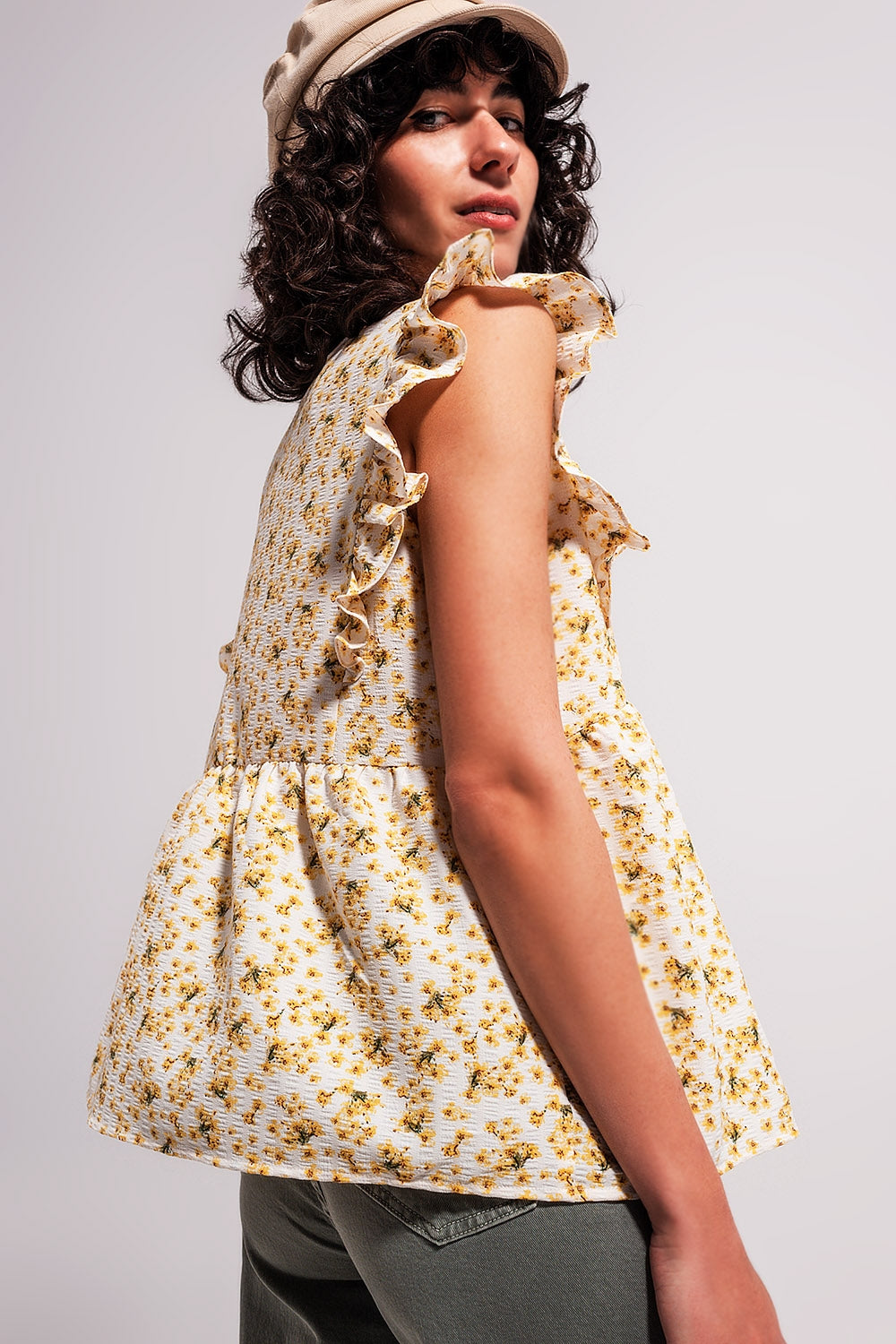 Blouse with embroidery and ruffle detail in yellow