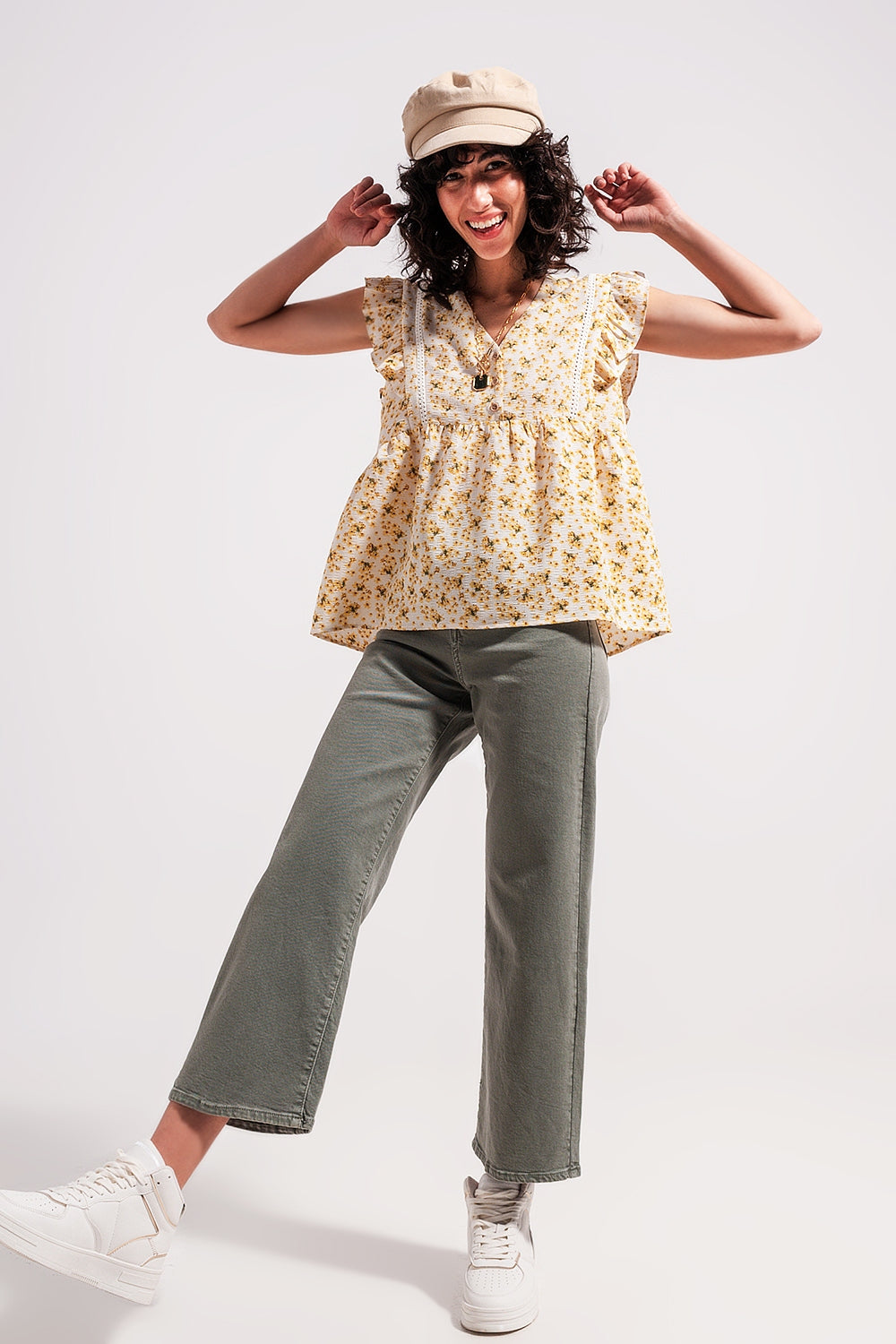 Blouse with embroidery and ruffle detail in yellow