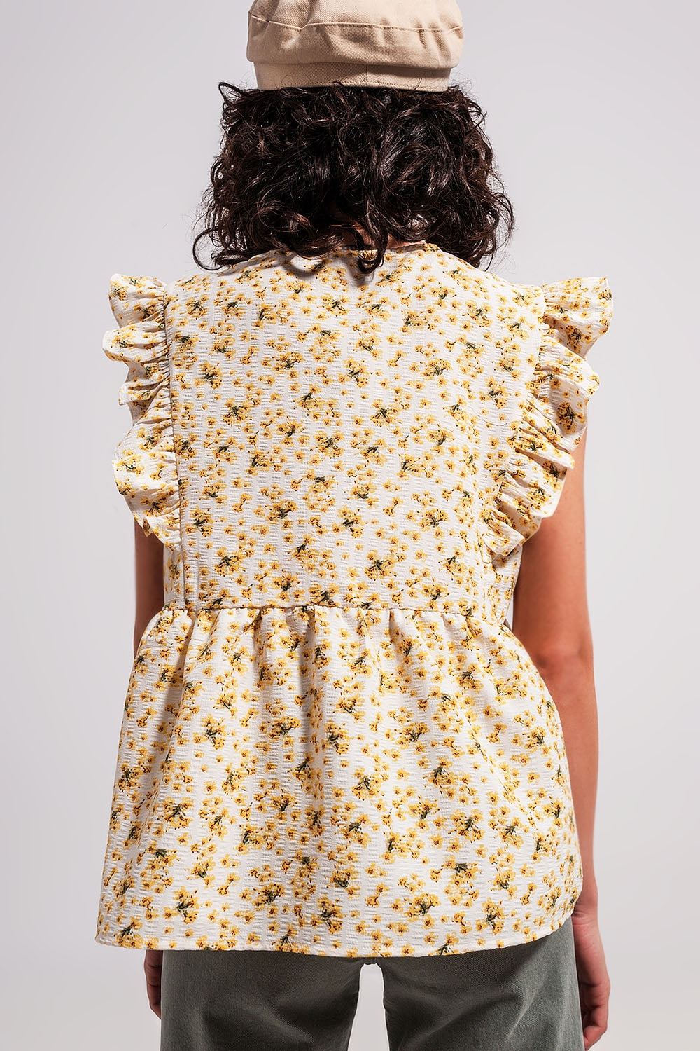 Blouse with embroidery and ruffle detail in yellow