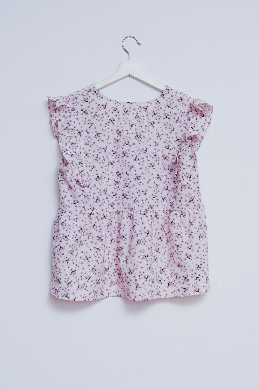 Blouse with embroidery and ruffle detail in purple