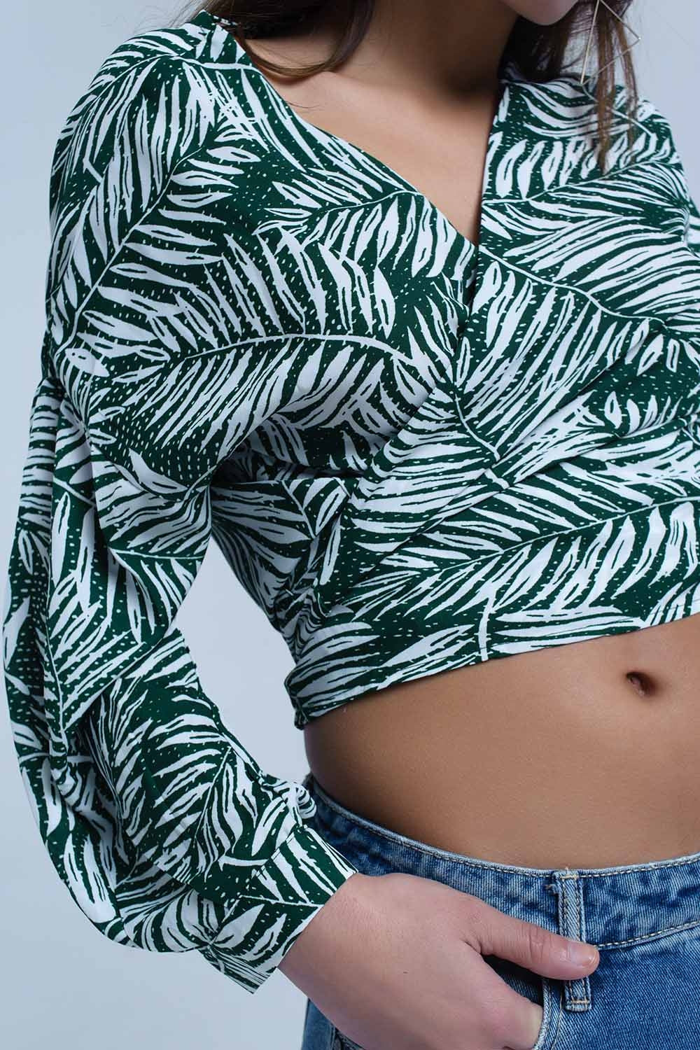 Green leaf print blouse with plunge neck