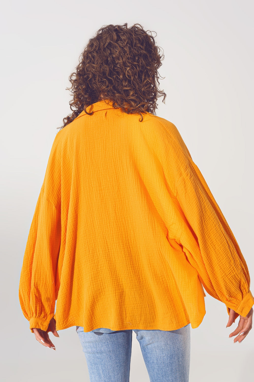 Loose-fitting blouse with texture in orange