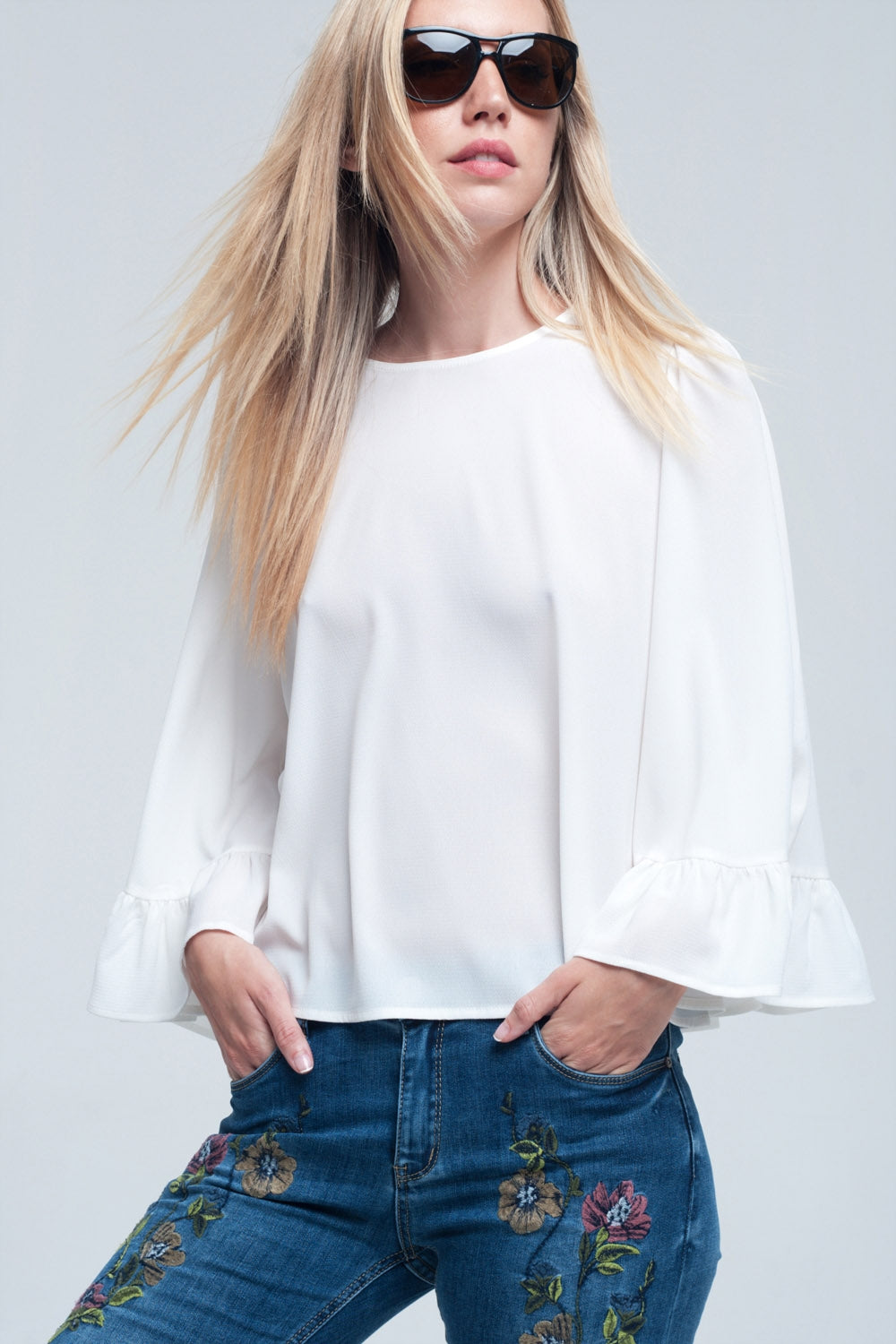 Q2 Witte blouse met plooidetail